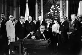 President Lyndon Johnson signs the Voting Rights Act of 1965